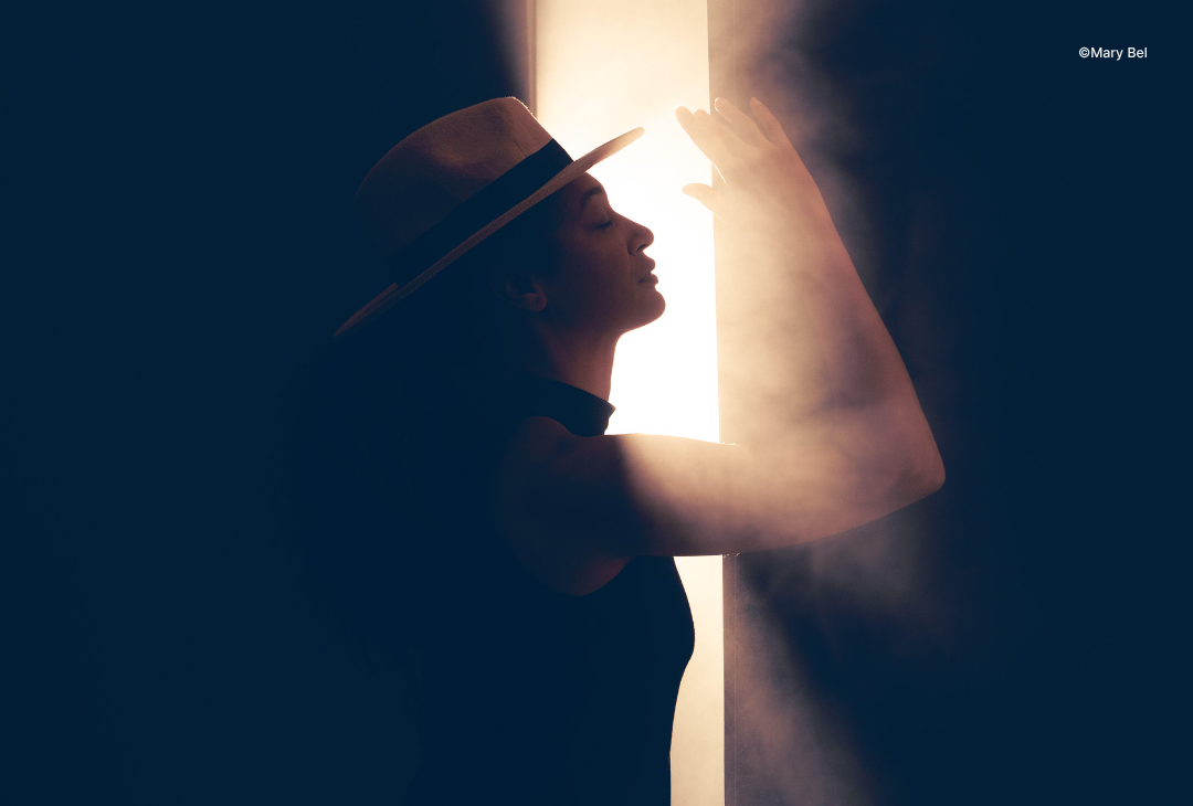 Backlit portrait photography with natural window light and warm tones